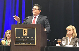 Secretary Pablos speaking at a podium to the Texas Municipal Clerks Association