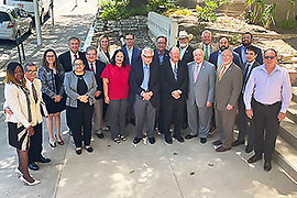 Group of smiling people standing together.