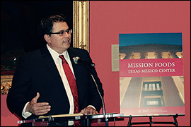 Secretary Pablos speaking at a podium.