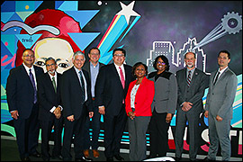 Secretary Pablos posing with others at the Austin Capitol Factory.