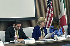 Secretary Nelson sitting at a table with leaders. 